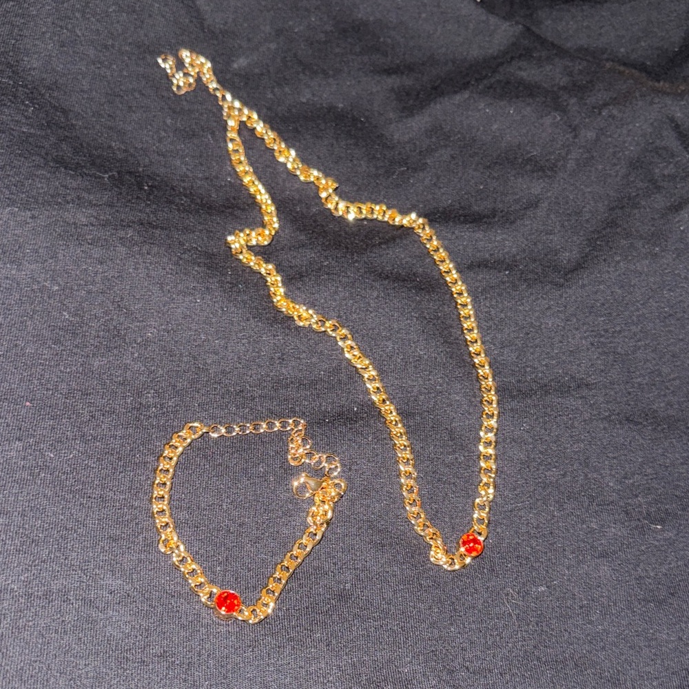 Elegant Gold Necklace and Bracelet Set with Red Accents